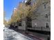An image of the exterior of an apartment building with a row of trees on the sidewalk in front at 1075 Peachtree Walk # A205, Atlanta, GA 30309