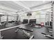 Bright gym features weightlifting machines, free weights, and mirrored wall for easy monitoring at 1075 Peachtree Walk # A205, Atlanta, GA 30309