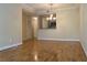 Open concept living room with hardwood floors next to the kitchen at 1075 Peachtree Walk # A205, Atlanta, GA 30309