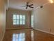 Bright living room featuring hardwood floors, neutral walls, and a ceiling fan at 1075 Peachtree Walk # A205, Atlanta, GA 30309
