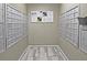 Mail room featuring secure individual mailboxes and a bulletin board at 1075 Peachtree Walk # A205, Atlanta, GA 30309