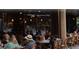 Inviting outdoor cafe seating with guests enjoying the ambiance and cafe fare at 1075 Peachtree Walk # A205, Atlanta, GA 30309
