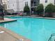 Exterior view of pool showcasing lounge chairs and well-kept landscaping at 1075 Peachtree Walk # A205, Atlanta, GA 30309
