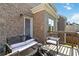 Cozy outdoor space with a brick wall, elegant furniture, and serene natural light at 2031 Broadmoor Way, Fairburn, GA 30213