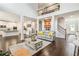 Spacious living room with an open concept and a view of the kitchen and staircase at 2031 Broadmoor Way, Fairburn, GA 30213