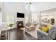 Inviting living room featuring a fireplace, soaring ceilings, and an open floor plan at 2031 Broadmoor Way, Fairburn, GA 30213