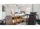Bright main bedroom with tray ceiling, ceiling fan, and hardwood floors, featuring a TV and seating area at 2031 Broadmoor Way, Fairburn, GA 30213