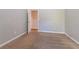 Neutral carpeted bedroom with light gray walls and a doorway to another room at 2931 Two Lake Cir, Atlanta, GA 30349