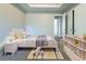 Cozy bedroom featuring neutral tones, comfortable bed, and bright, natural light at 2931 Two Lake Cir, Atlanta, GA 30349
