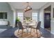 Dining room with a round table, modern lighting, and lots of natural light at 2931 Two Lake Cir, Atlanta, GA 30349