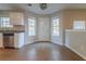 Bright kitchen with stainless steel dishwasher, tile floors, granite counters, and a breakfast area with natural light at 2931 Two Lake Cir, Atlanta, GA 30349