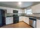 Functional kitchen with stainless steel appliances, ample counter space, and classic cabinets at 2931 Two Lake Cir, Atlanta, GA 30349