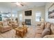 Inviting living room with cozy seating, fireplace, and large windows at 2931 Two Lake Cir, Atlanta, GA 30349