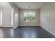 Sunlit living room with hardwood floors and a front door view at 2931 Two Lake Cir, Atlanta, GA 30349