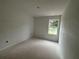 Empty bedroom with plenty of natural light from a window, ready for your personal touch at 4428 Ryan St, Douglasville, GA 30135