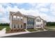 Charming townhomes featuring a mix of brick and siding, enhancing curb appeal and architectural detail at 4428 Ryan St, Douglasville, GA 30135
