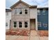 New townhome construction featuring a mix of brick and siding, highlighting modern design at 4428 Ryan St, Douglasville, GA 30135