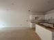 Unfinished interior featuring a partial kitchen installation with white cabinets and a central island frame at 4428 Ryan St, Douglasville, GA 30135