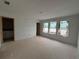 Open-concept living space with plenty of natural light from the three windows at 4428 Ryan St, Douglasville, GA 30135