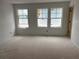 Spacious bedroom featuring three bright windows, offering ample natural light, awaiting personalization at , Douglasville, GA 30135
