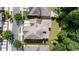 Aerial shot of a home with a well-maintained roof, surrounded by lush trees and a green lawn at 10580 Grandview Sq, Johns Creek, GA 30097