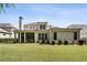 Expansive backyard with lush green lawn, patio, and mature landscaping, perfect for outdoor enjoyment at 10580 Grandview Sq, Johns Creek, GA 30097