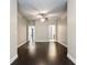 Generously sized bedroom featuring hardwood floors, neutral paint, and a ceiling fan at 10580 Grandview Sq, Johns Creek, GA 30097
