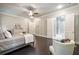 This bedroom features hardwood floors, natural light, and an ensuite bathroom with glass shower at 10580 Grandview Sq, Johns Creek, GA 30097
