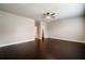 Large bedroom featuring hardwood floors, walk in closet, and neutral paint at 10580 Grandview Sq, Johns Creek, GA 30097