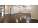 Spacious bonus room with hardwood floors, neutral walls, and abundant natural light at 10580 Grandview Sq, Johns Creek, GA 30097