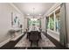 Formal dining room with stylish chandelier, large windows, and elegant decor at 10580 Grandview Sq, Johns Creek, GA 30097