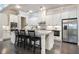 Spacious kitchen with white cabinets, stainless steel appliances, and a large center island at 10580 Grandview Sq, Johns Creek, GA 30097