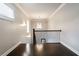 Upstairs landing with hardwood floors, decorative railing, and natural light at 10580 Grandview Sq, Johns Creek, GA 30097