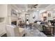 Spacious living room with fireplace, hardwood floors, neutral color palette, and open layout to the kitchen at 10580 Grandview Sq, Johns Creek, GA 30097