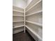 Walk-in pantry with multiple white shelves, offering ample storage space at 10580 Grandview Sq, Johns Creek, GA 30097