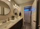 Bright bathroom featuring a double vanity, modern fixtures, and a shower area, designed for comfort and style at 1132 Red Bud Cir, Villa Rica, GA 30180