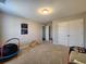 This room features a gray carpet, neutral wall paint, natural lighting, and play equipment, offering a space for creativity at 1132 Red Bud Cir, Villa Rica, GA 30180