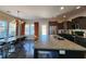 Bright kitchen featuring a large island with seating, stainless steel appliances, and an open dining area at 1132 Red Bud Cir, Villa Rica, GA 30180