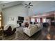 Open-concept living room with vaulted ceilings, modern fireplace, and seamless flow to the kitchen at 1132 Red Bud Cir, Villa Rica, GA 30180