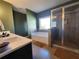 Spacious main bathroom showcasing a soaking tub, glass-enclosed shower, and modern vanity with ample counter space at 1132 Red Bud Cir, Villa Rica, GA 30180