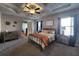 Serene main bedroom featuring a tray ceiling, plush carpeting, and elegant furnishings, ideal for relaxation at 1132 Red Bud Cir, Villa Rica, GA 30180