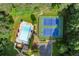 An aerial view showcasing a community pool and tennis courts surrounded by lush greenery at 2789 Brookcliff Lndg, Marietta, GA 30062