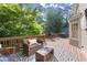 Cozy outdoor deck area with comfortable seating, a grill, and scenic views at 2789 Brookcliff Lndg, Marietta, GA 30062