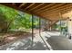 Covered patio area perfect for outdoor activities, with views of the spacious backyard at 2789 Brookcliff Lndg, Marietta, GA 30062