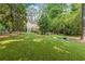 A sprawling backyard featuring mature trees and lush greenery at 2789 Brookcliff Lndg, Marietta, GA 30062