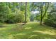 Expansive backyard with lush green grass surrounded by mature trees at 2789 Brookcliff Lndg, Marietta, GA 30062