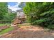 The backyard features a spacious deck, lush greenery, and mature trees at 2789 Brookcliff Lndg, Marietta, GA 30062