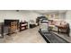 Basement area with a treadmill, desk, and neutral walls over tile flooring at 2789 Brookcliff Lndg, Marietta, GA 30062