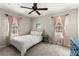 Cozy bedroom with neutral tones, plush carpet, and two large windows at 2789 Brookcliff Lndg, Marietta, GA 30062