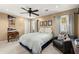 Bright bedroom with a ceiling fan, a comfortable bed and a desk with Atlanta Braves decor at 2789 Brookcliff Lndg, Marietta, GA 30062